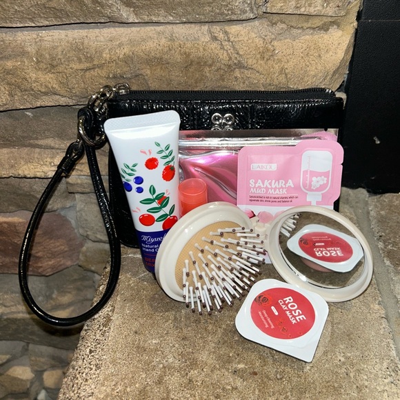 Coach Handbags - Vintage Black Coach Wristlet filled with beauty products